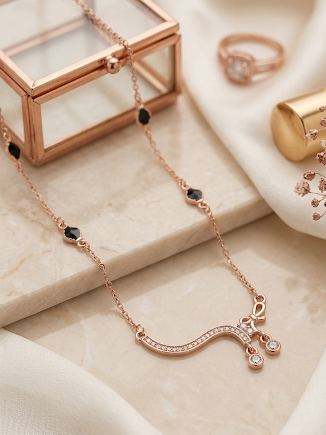 Rose Gold Curved Crystal Wave Necklace with Black Bead Accents
